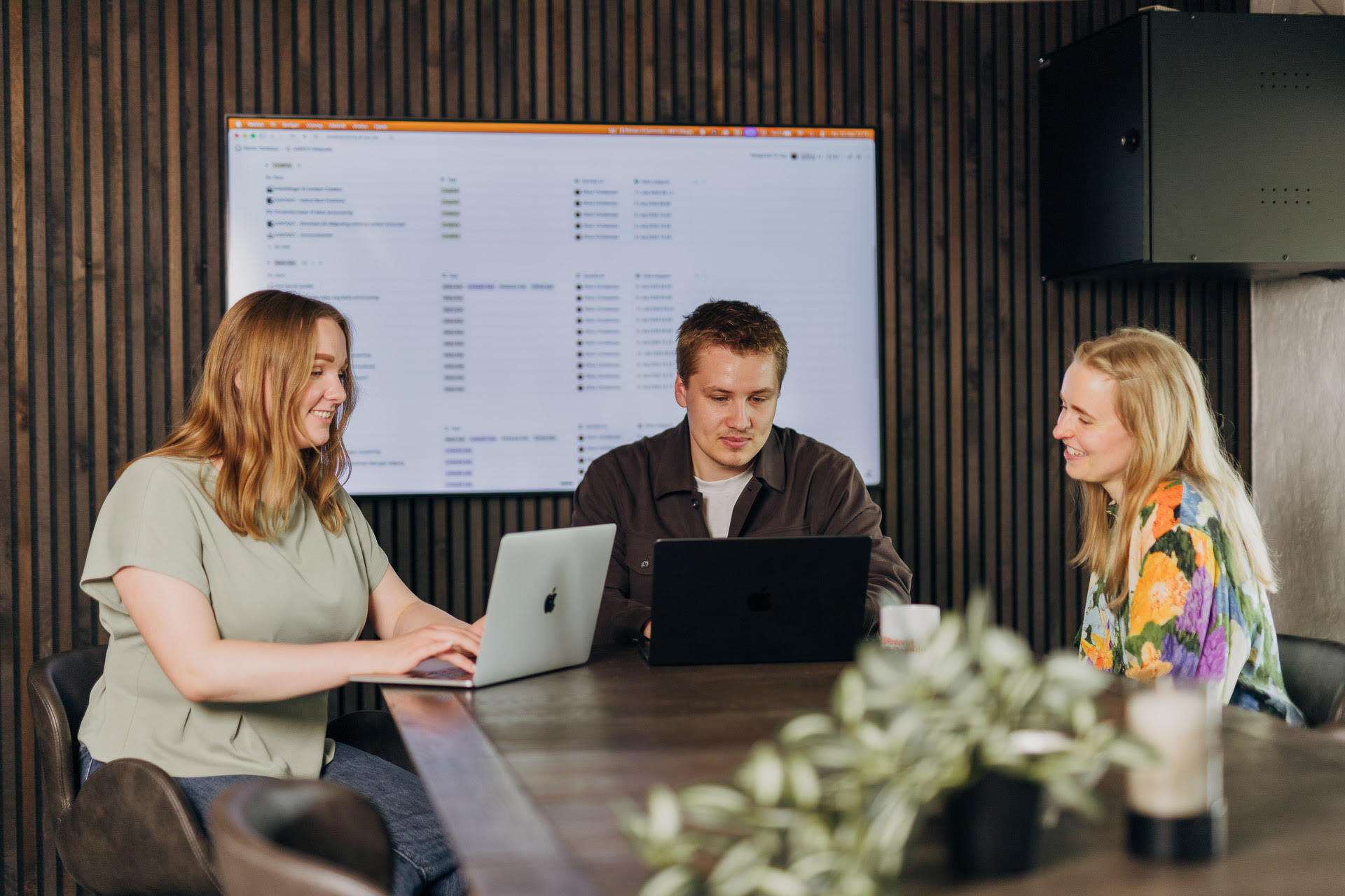Asento team working together in a meeting